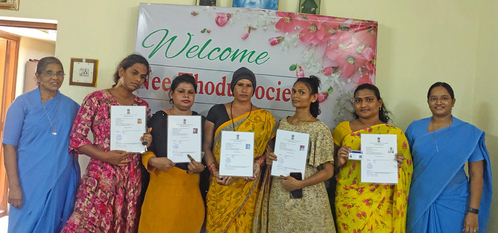 The sheet that they are holding is their transgender Identity card and certificate.